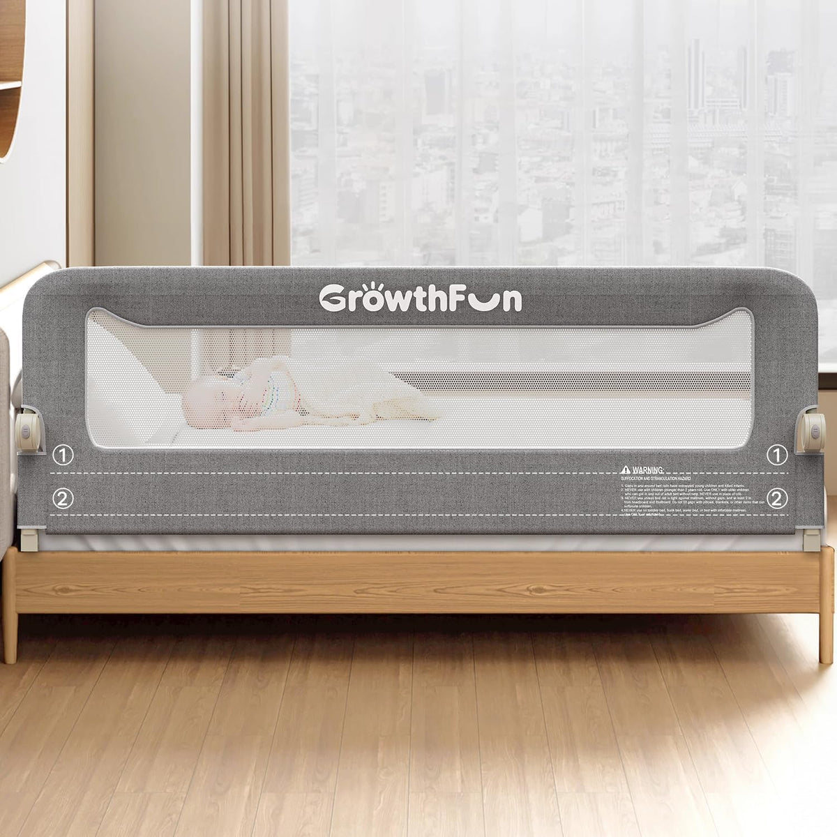 GrowthFun baby bed rail guard in grey with breathable mesh panel installed on a wooden bed